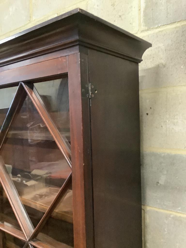 A George III mahogany bookcase with two astragal glazed doors, on later feet, width 116cm